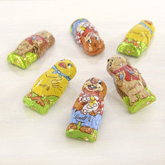 Piccoli Amici di Pasqua al Cioccolato | 2 x 100 g e Mini Uova Decorazione di Cioccolato con Latte Alpino | 2 bustine da 180 g | Uova di cioccolato al latte premium, confezionate in modo allegro e colorato, in quattro colori per Pasqua