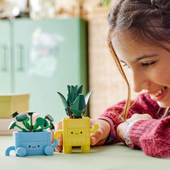LEGO Botanicals Happy Plants - Set fai da te per bambini con 2 fiori artificiali e 2 vasi da fiori colorati con facce di cartoni animati - Idea regalo per ragazze dai 9 anni - 10349 Besuche set da costruzione den LEGO-Store