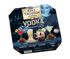 Edle Tropfen in Nuss Vodka Lounge 100g, praline di cioccolato ripiene di liquido con glassa di cioccolato al latte e pezzetti croccanti di nocciola
