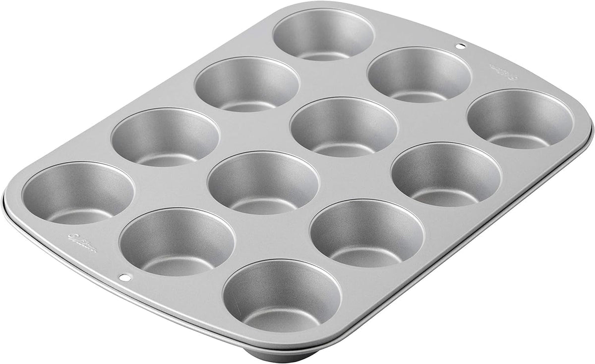 Wilton 03-3118 Stampo per cupcake/muffin, ricetta destra, antihaft, 12 vertiefungen, Grau Stampi e teglie Naty Shop
