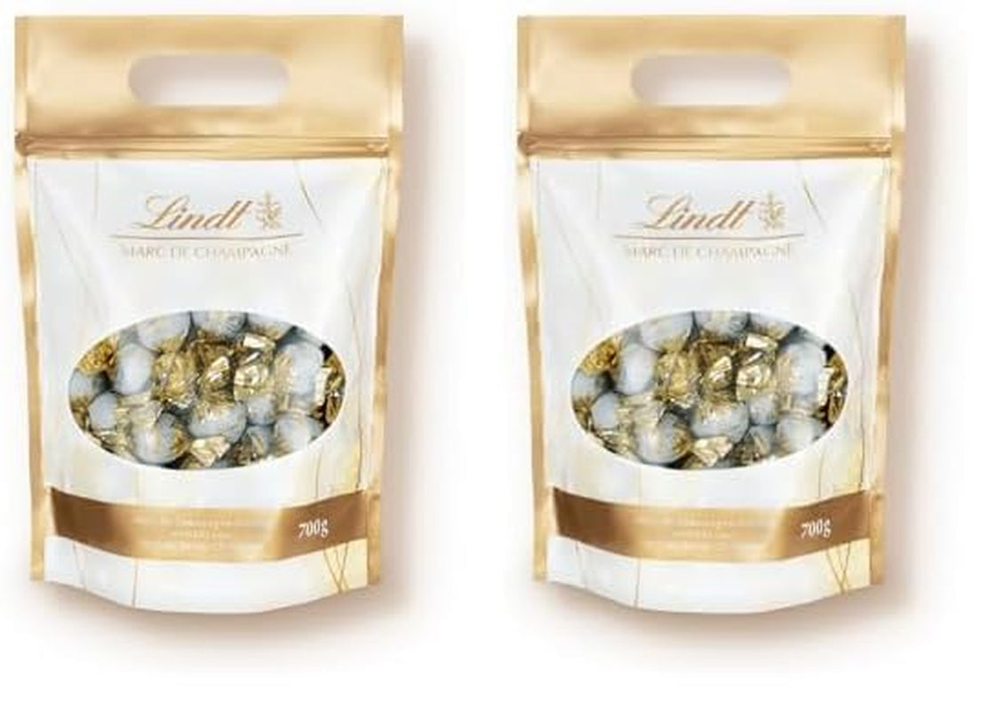 Lindt Marc de Champagne Palline di cioccolato | 700 g ca. 56 cioccolatini al latte con ripieno raffinato, contengono alcol | Pacchetto sfuso | Regalo di cioccolato | Regalo di cioccolato