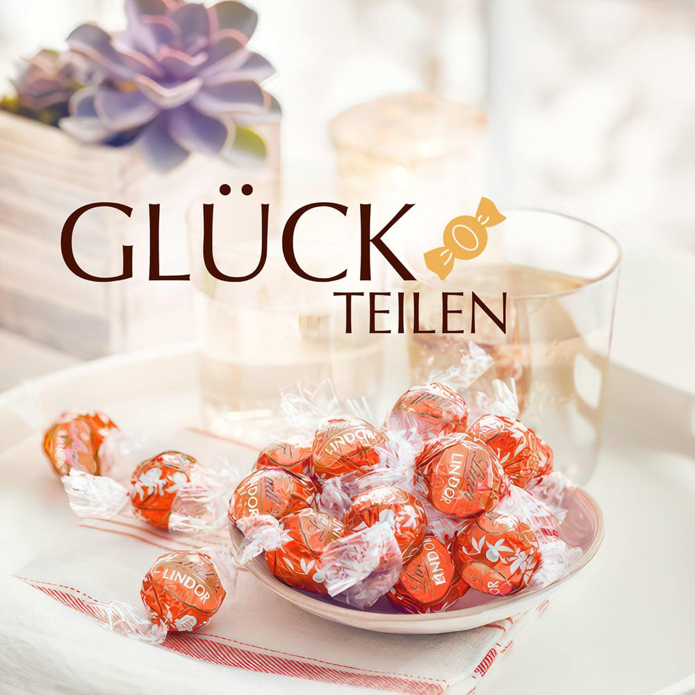 Lindt LINDOR Palline di cioccolato all'arancia rossa | Busta richiudibile da 1 kg | ca. 80 cioccolatini con ripieno scioglievole in bocca | Confezione sfusa, regalo di cioccolato