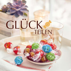 Cioccolata Lindt | Borsa assortita LINDOR argento | Sacco da 1 kg | 80 palline di cioccolato al latte fondente al gusto 70%, caramello salato e doppio cioccolato | Regalo di cioccolato da condividere