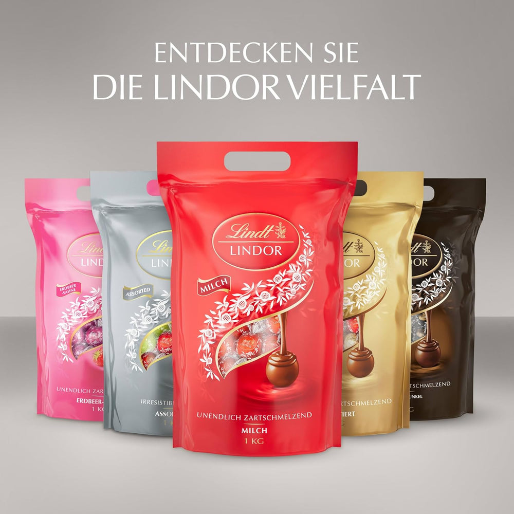 Cioccolata Lindt | Borsa assortita LINDOR argento | Sacco da 1 kg | 80 palline di cioccolato al latte fondente al gusto 70%, caramello salato e doppio cioccolato | Regalo di cioccolato da condividere